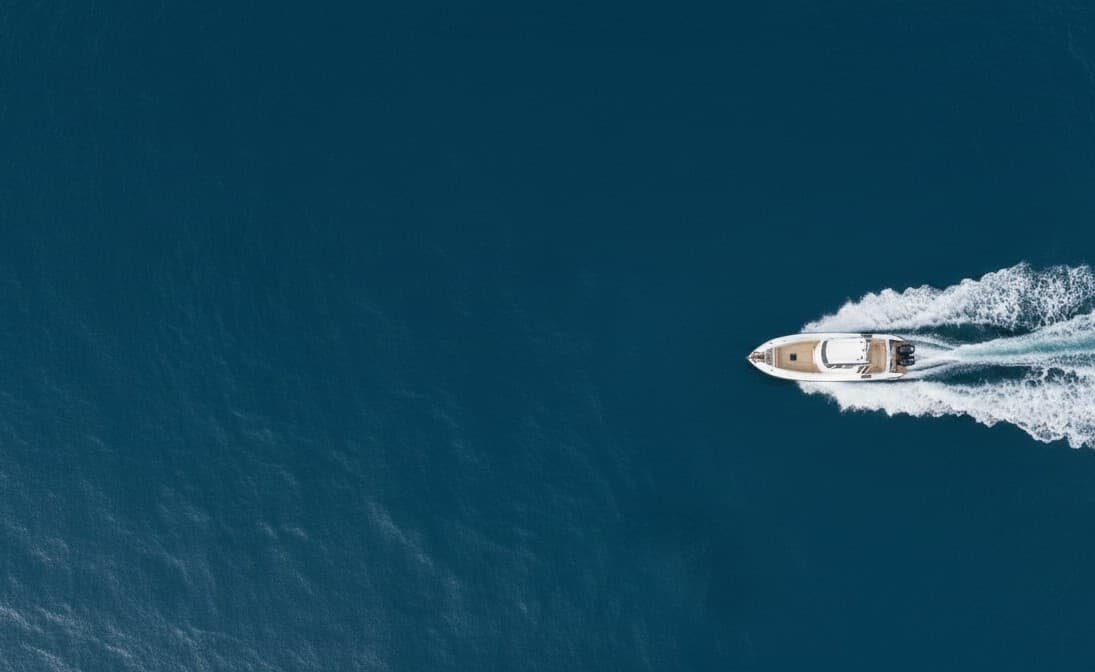 Aerial view of a boat running across open water